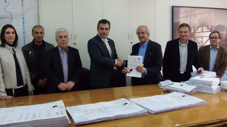 Constantinos Yiorkadjis, mayor, Nicosia, (L) and Stavros Theodosiou, CEO, A.Panayides Contracting with other municipality and company staff